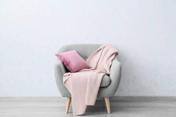 Soft armchair near light wall in room - Fotografie, Obrázek