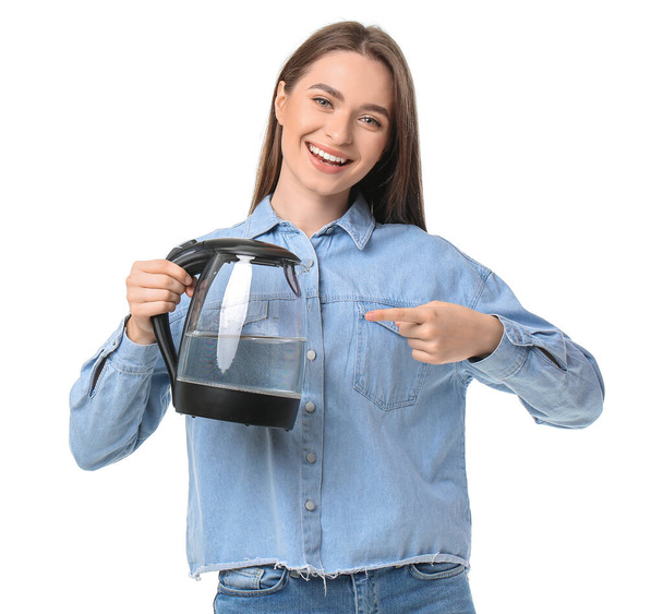 Young woman with electric kettle on white background - Photo, Image