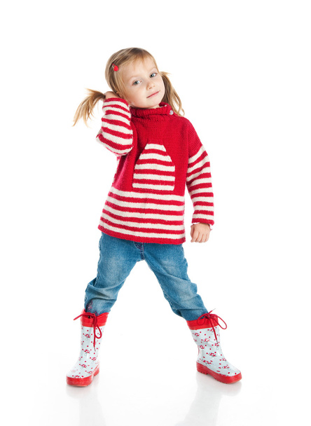 Little girl wearing sweater and gumboots - 写真・画像
