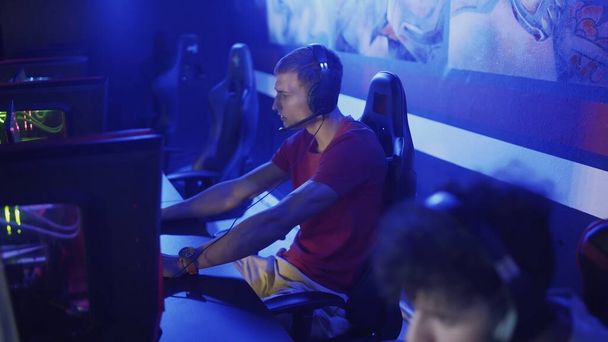 Team of Professional eSport Gamers playing in Competitive MMORPG Strategy Video Game on a Cyber Games Tournament. - Фото, зображення