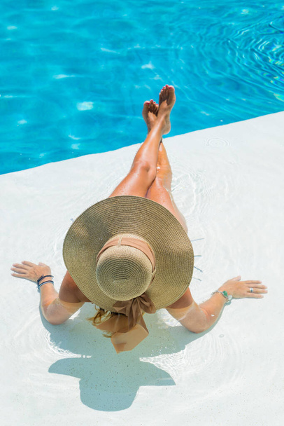 woman in luxury five stars  spa resort in the swimming pool.  - Foto, Imagen