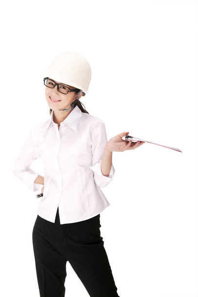Business woman wearing a safety helmet - Fotó, kép