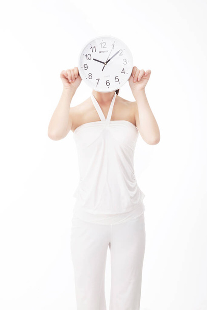 Young fashion woman holding clocks - Фото, зображення