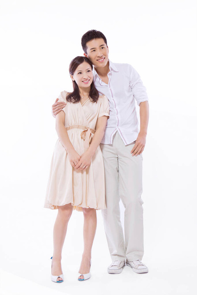 Young couple on white background - Foto, imagen