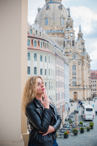 Tourism concept. Beautiful woman look at view of city streets, centre of city. Vacation Germany - Photo, image