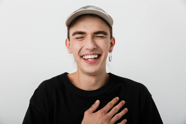 Portrait closeup of cheerful happy man wearing black clothes laughing at camera over white background - Foto, imagen