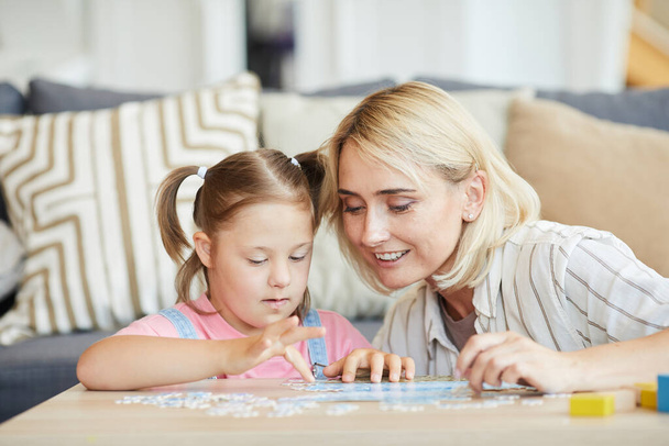 Mother and daughter collecting puzzles - Photo, Image