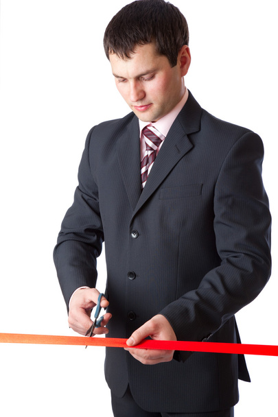 Businessman and red ribbon. Isolated on white background - Valokuva, kuva