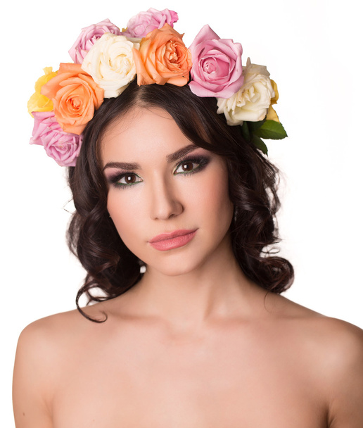 Beautiful young woman with floral wreath. Fashion shot. Closeup portrait. Fashion jewelry. Beauty portrait. - 写真・画像