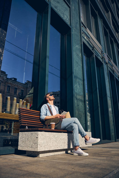 Relaxed young man catching lights of the sun - Fotografie, Obrázek