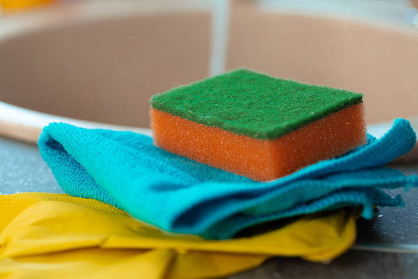 Cleaning sponge and rag on kitchen counter - Photo, image