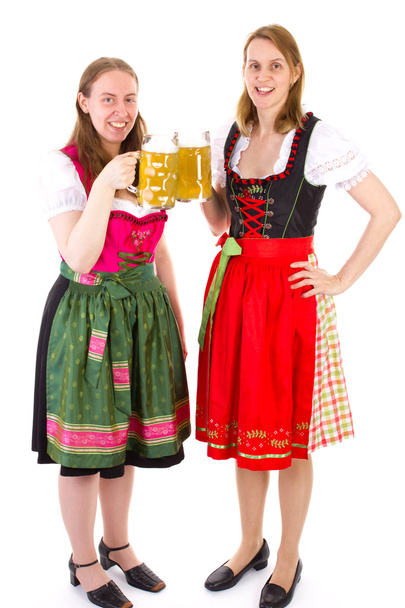 Hermosas mujeres en dirndl beber cerveza doble en la fiesta bavariana
 - Foto, imagen