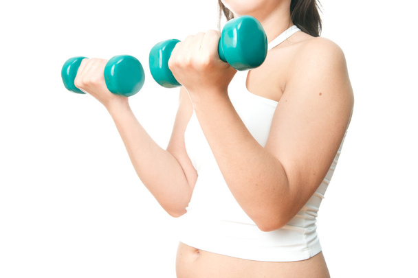 Girl with green dumbbells in hand - Photo, Image