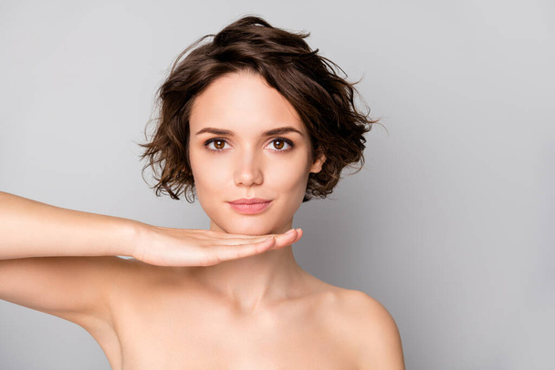 Closeup photo of beautiful naked lady bobbed short hairstyle look mirror reflection hold hand under chin good operation result isolated grey color background - Photo, Image