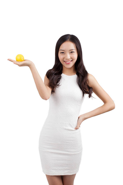 	Young woman holding lemon	 - Φωτογραφία, εικόνα