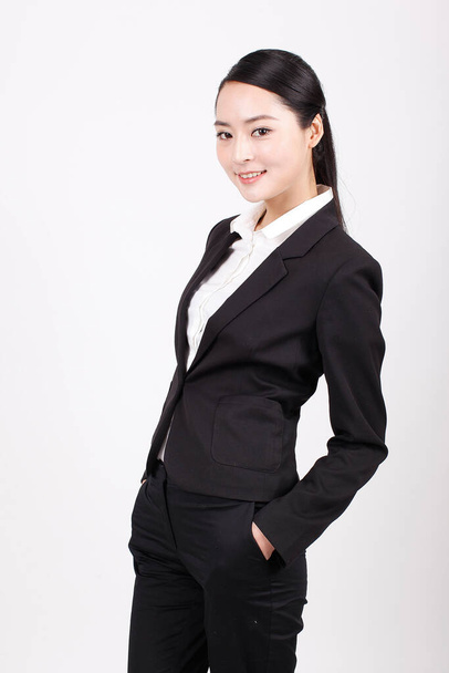 A young business woman standing in different positions - Foto, Bild