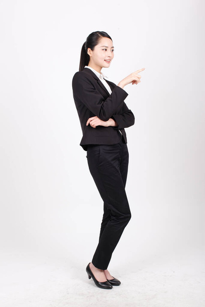 A young business woman standing in different positions - Fotoğraf, Görsel