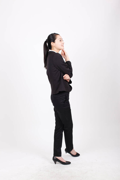 A young business woman standing in different positions - Valokuva, kuva
