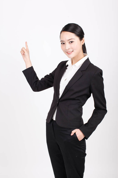 A young business woman standing in different positions - Foto, Bild