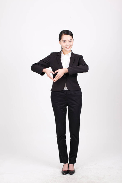 A young business woman standing in different positions - Foto, imagen
