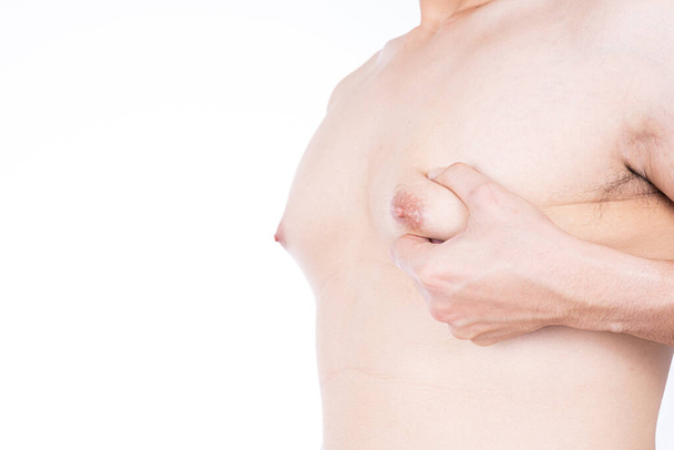 Close up man holding men boobs on white background. Diet, weight loss, slim body, healthy lifestyle concept. - Photo, Image