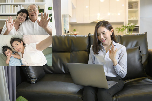 A young asian woman is using laptop computer to Video calling or Webcam to greeting her family  ,  telecommunications technology , parenthood family concept . - Foto, Imagem