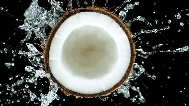Freeze Motion of Water Splashing on Coconut - Valokuva, kuva