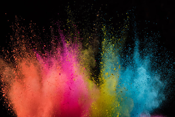 Colored powder explosion on black background. - Foto, immagini