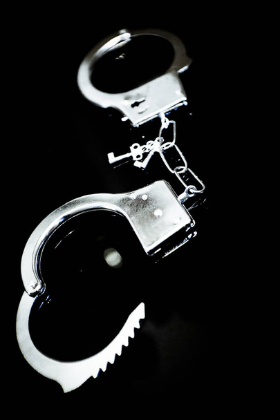 Silver metallic handcuffs for erotic bondage games. No people - Fotoğraf, Görsel