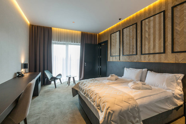 Interior of a luxury hotel bedroom in mountain hotel resort - Foto, imagen