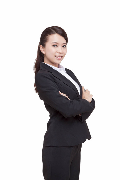 	Portrait of young businesswoman standing,folding arms	 - Foto, Imagen