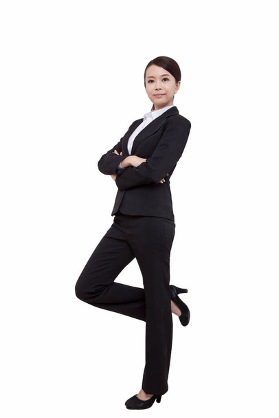 	Portrait of young businesswoman standing,folding arms	 - Foto, imagen