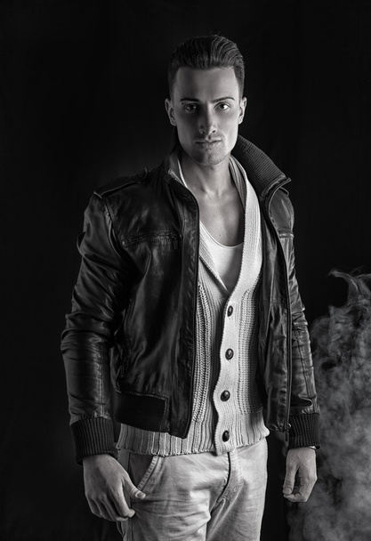 Handsome young man with white sweater and black leather jacket. - Φωτογραφία, εικόνα