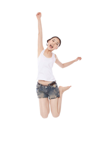 	Young woman jumpping,yelling	 - 写真・画像