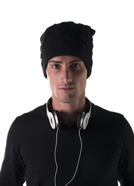 Attractive young man with black wool hat and headphones - Fotografie, Obrázek