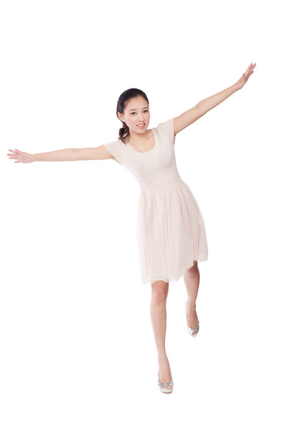 	Young woman standing with arms stretched	 - Foto, Bild