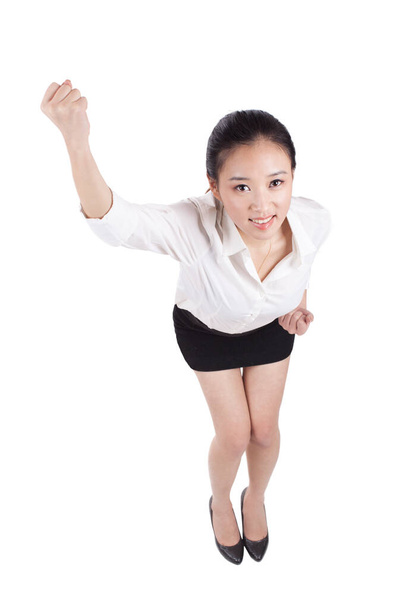 	Young business woman clenching fists and smiling	 - 写真・画像