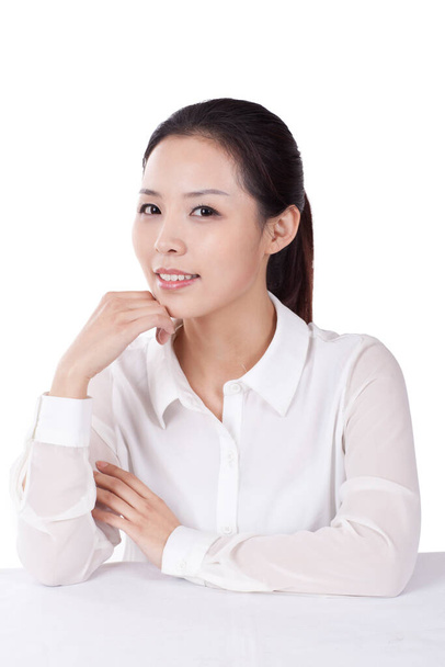 	Portrait of young female office worker with hand on chin	 - Фото, зображення