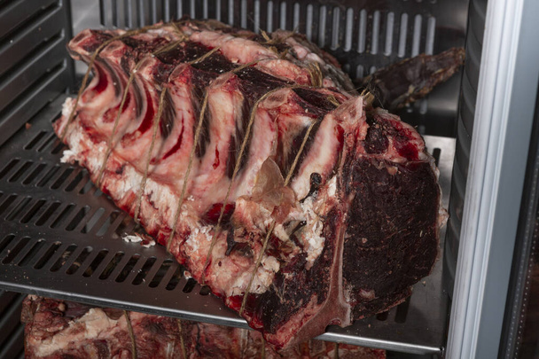 Meat in dry aging meat refrigerator - Foto, Bild