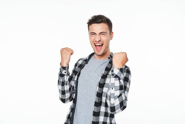 Young   man with fists   in studio,  isolated  background - Foto, immagini