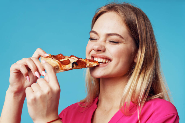 happy woman  eating   pizza  on isolated background  - Photo, Image