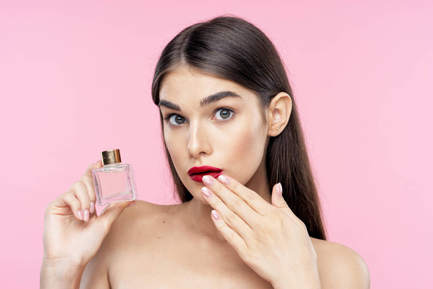 Portrait of young beautiful woman with perfume bottle  - Fotoğraf, Görsel