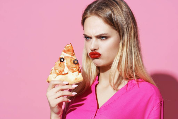 woman with pizza in studio. High quality photo - Photo, Image