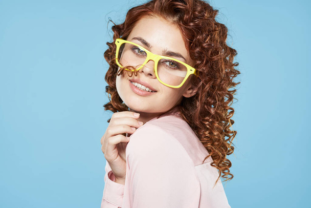 young beautiful woman in glasses posing in studio - Foto, Imagen