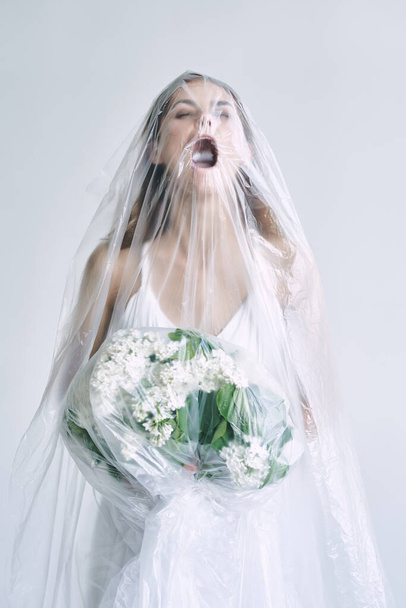 young bride covered with plastic tape  - Фото, зображення
