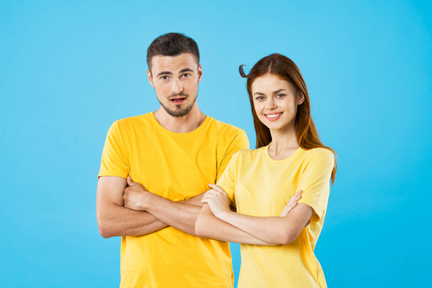 young beautiful couple posing in studio on isolated background - Fotografie, Obrázek