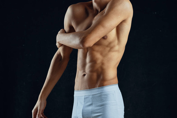 Young muscular fit  man  in studio - Фото, изображение