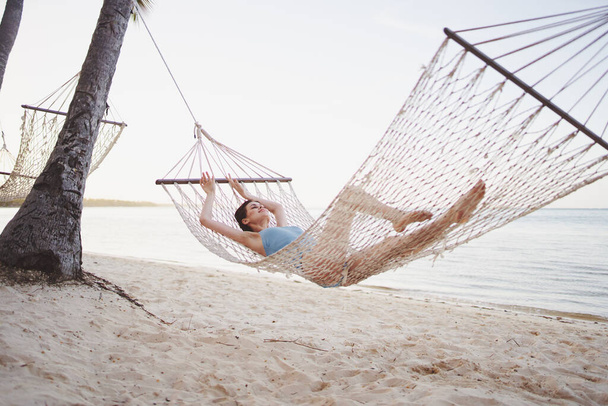 Young beautiful woman relaxing in hammock  - Foto, Imagem