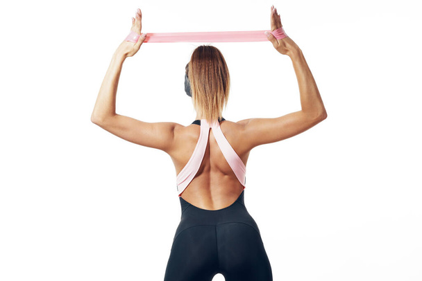 young  fit woman in sportswear exercising in studio - Zdjęcie, obraz