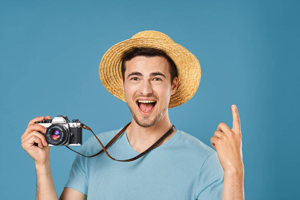 young handsome man tourist with camera in studio - Valokuva, kuva